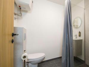 a bathroom with a toilet and a shower at Motel Anić in Novi Travnik +42 photos