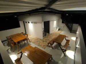 an overhead view of a room with tables and chairs at Rullah Homestay in Karimunjawa