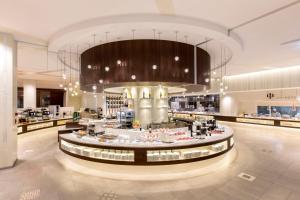 a shopping mall with a food court in the middle at Midorinokaze Resort Kitayuzawa in Date