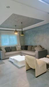 a living room with a couch and a table at Appartement meublé harhora in El Harhoura +1 photo
