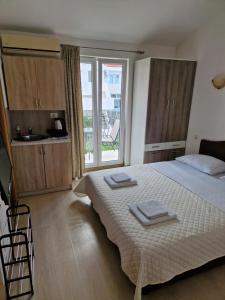 Postel nebo postele na pokoji v ubytování Guest House Damjana