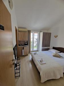 Postel nebo postele na pokoji v ubytování Guest House Damjana