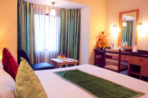 Postel nebo postele na pokoji v ubytování Highgates Hotel