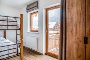 Posteľ alebo postele v izbe v ubytovaní Holiday Homes Obertraun - Oberösterreich 86