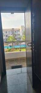 an open door with a view of a building at perla Saïdia in Saidia 