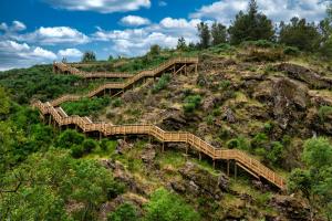 a group of wooden stairs on a hill at Serra da Estrela - Casa Castro in Gouveia
