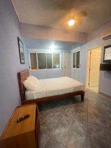 a bedroom with a bed in a room at Playa Almedro RESORT in Volcán Chimborazo