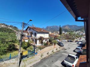 a view of a street with cars parked at Pousada do Gil in Teresópolis