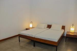 Letto o letti in una camera di The Mango Nest