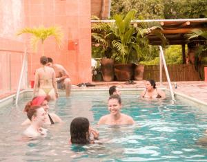 a group of people in a swimming pool at Casa Pepe in Sayulita
