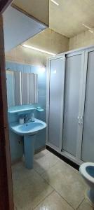 a bathroom with a sink and a shower at Appartement immobilier à Fès in Ville Nouvelle