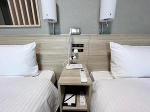 Postel nebo postele na pokoji v ubytování Hotel Route Inn Rifu