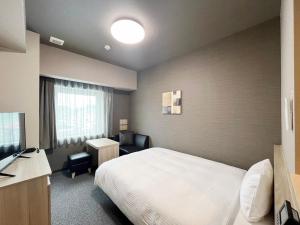 Postel nebo postele na pokoji v ubytování Hotel Route Inn Rifu + 29 fotografií