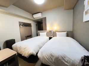 Postel nebo postele na pokoji v ubytování Hotel Route Inn Rifu