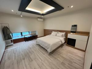Postel nebo postele na pokoji v ubytování Ilsan Noble Hotel