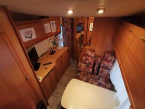 an overhead view of a small room with a desk at Miklós FKK Naturist in Szigetszentmiklós