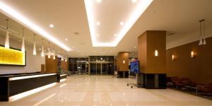 a lobby of a building with a large ceiling at Hotel Kanazawa in Kanazawa