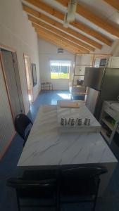a large room with a table and chairs in it at Huella de Luna in Valdivia
