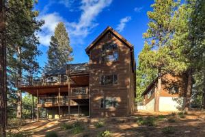 a house in the woods with trees at On Tahoe Time - Pets Pool Table Game Room in South Lake Tahoe
