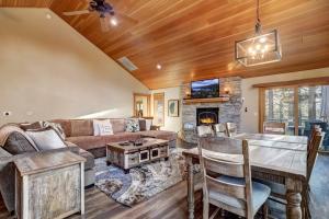 a living room with a couch and a table at On Tahoe Time - Pets Pool Table Game Room in South Lake Tahoe