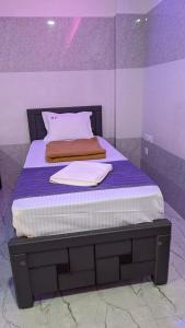 Postel nebo postele na pokoji v ubytování HOTEL PANCHAVARNAA
