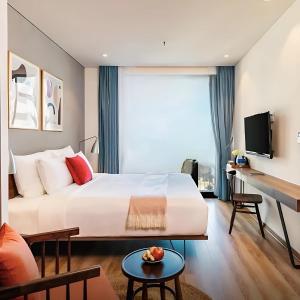 Giường trong phòng chung tại Khách Sạn Tây Ninh LaNa