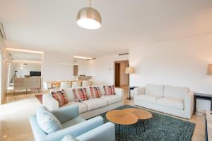 a living room with two couches and a table at Estoril Biarritz - Luxury Sea View - Center Apart in Estoril