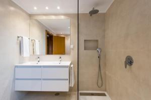 a bathroom with a sink and a shower at Estoril Biarritz - Luxury Sea View - Center Apart in Estoril +44 photos