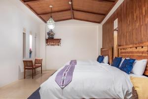 Rúm í herbergi á Kenting Shen's Homestay