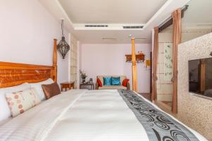 Rúm í herbergi á Kenting Shen's Homestay