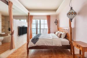Rúm í herbergi á Kenting Shen's Homestay
