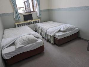 Postel nebo postele na pokoji v ubytování Pension Pure