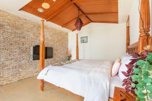 Rúm í herbergi á Kenting Shen's Homestay
