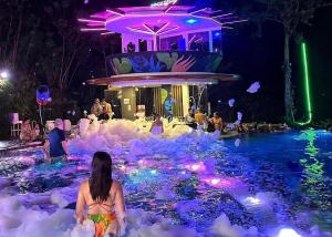 a woman sitting in an ice pool at night at Fairways and Bluewater Boracay in Boracay
