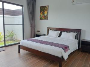Katil atau katil-katil dalam bilik di Ream Yoho Hotel