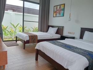 Katil atau katil-katil dalam bilik di Ream Yoho Hotel