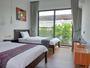 Katil atau katil-katil dalam bilik di Ream Yoho Hotel
