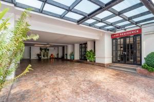 an empty lobby of a building with a glass ceiling at Luxe Residence in Pattaya Central