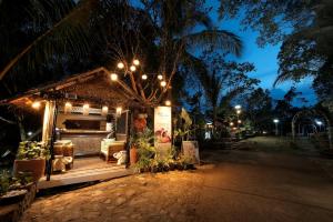 a food stand at night with lights on it at Villa Khadine Grand Vista Resort in Coron