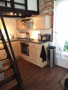 A kitchen or kitchenette at Thatched Farm Holiday Cottages 