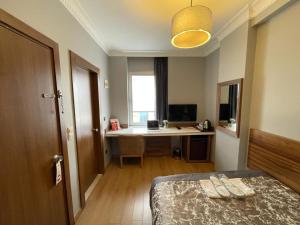 TV a/nebo společenská místnost v ubytování My Rose Hotel