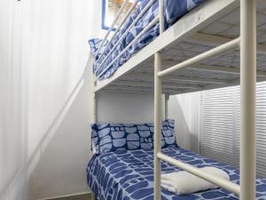 a bedroom with a bunk bed and a ladder at Terraza de Triana in Seville