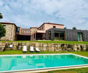a house with a swimming pool in front of a house at Casa Lis in Atei