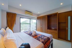 a bedroom with a large bed with a television at Beachfront 2 bed Condo with Seaview! - BW2 in Hua Hin +67 photos