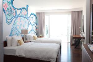 Postel nebo postele na pokoji v ubytování Movenpick Luxury Residence Pattaya-by Noah + 41 fotografií