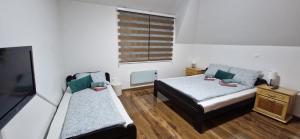 Postel nebo postele na pokoji v ubytování Apartman Vuk Zlatar