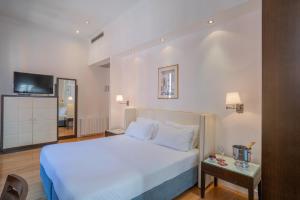 Postel nebo postele na pokoji v ubytování Residenza San Marco " La Padrona"