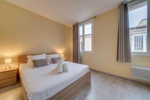 Letto o letti in una camera di Le Richelieu - Magnifique duplex avec une vue Incroyable