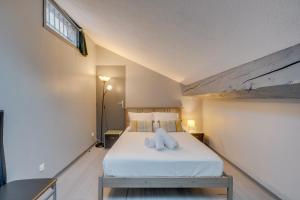 Letto o letti in una camera di Le Richelieu - Magnifique duplex avec une vue Incroyable