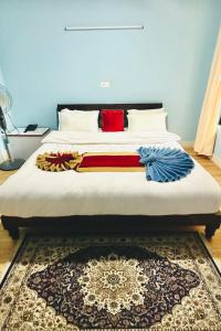 Postel nebo postele na pokoji v ubytování PS Boutique Hotel